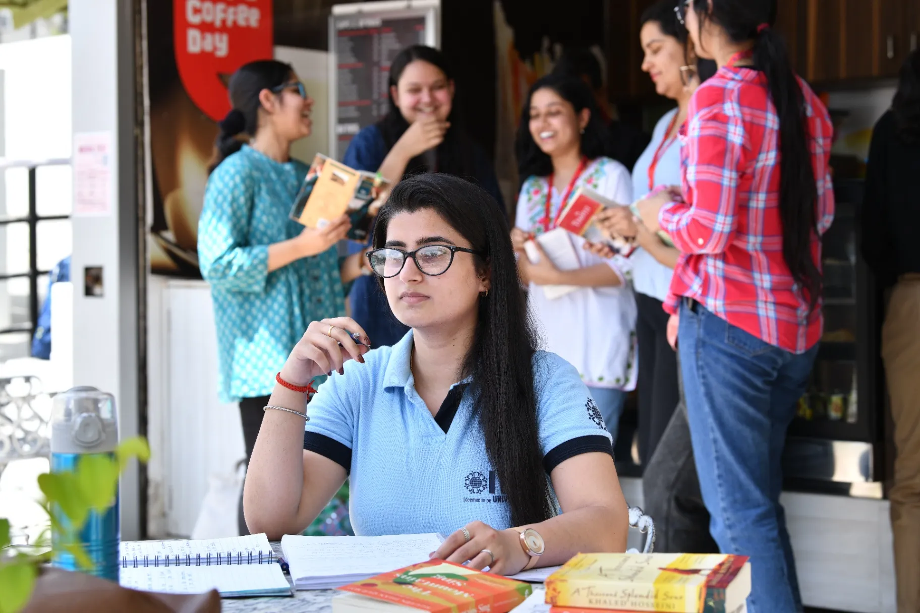 Girl student studying and group discussion at IIS University Jaipur girls college campus